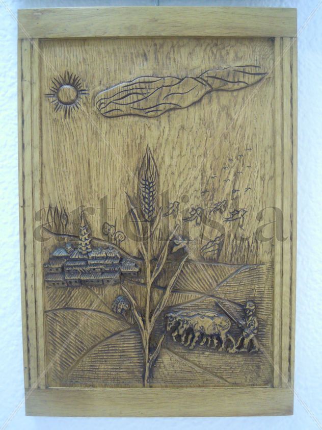 Espiga y arando el campo