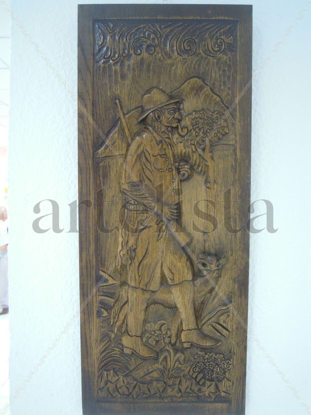 Cazador con cahimba y perro