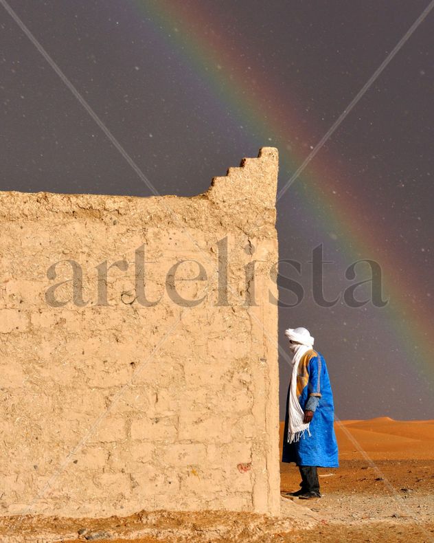 Rainbow and rain in the desert.