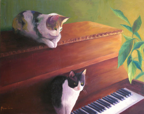 Gatos sobre el piano